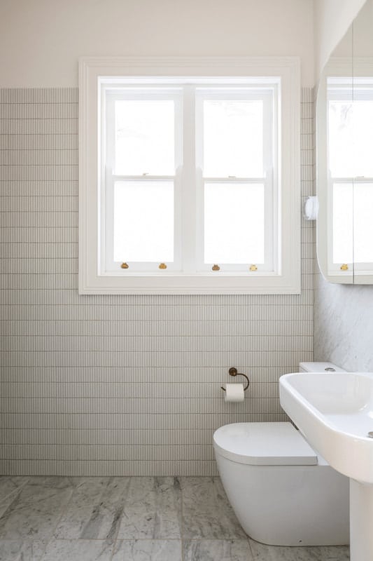 White Toilet In A Bathroom — Windows & Doors in Central Coast, NSW