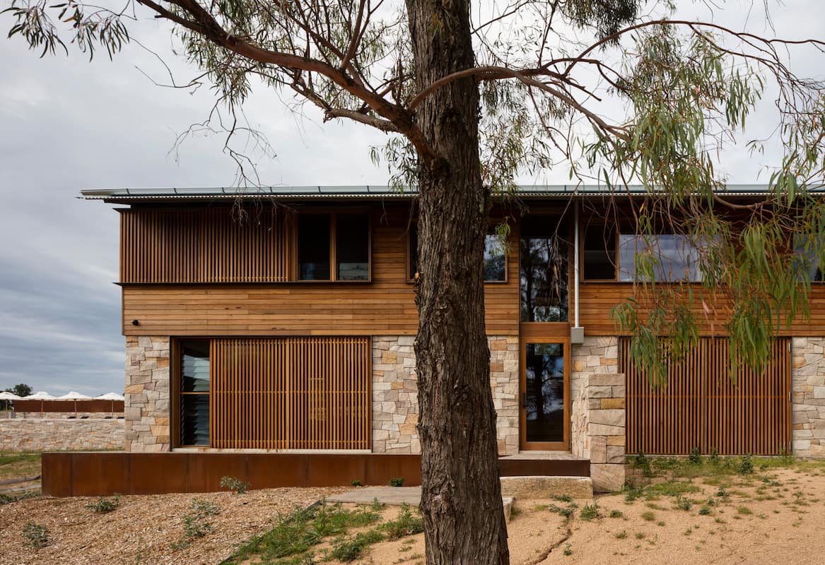 Brick And Wood House Design With Tree — Windows & Doors in Central Coast, NSW